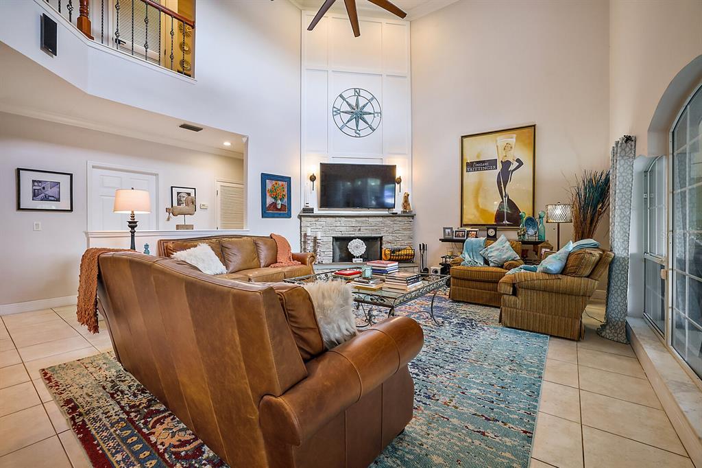 2701 Regal Point Place Eustis, FL 32726 - Photo 42 of 53 a living room with furniture and a flat screen tv