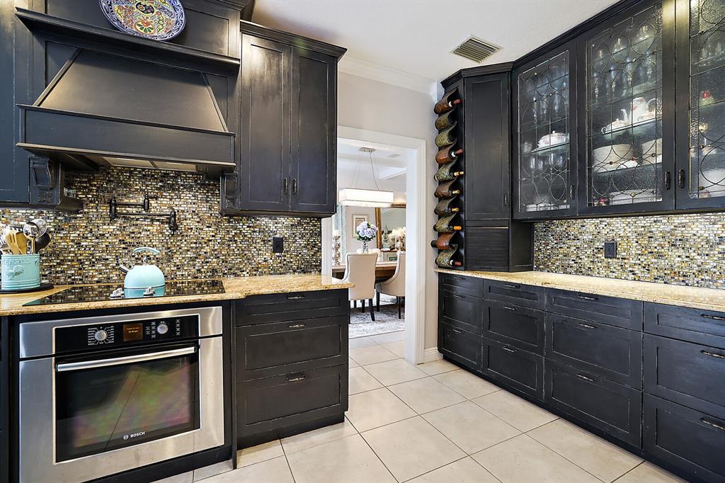 2701 Regal Point Place Eustis, FL 32726 - Photo 48 of 53 a kitchen with stainless steel appliances granite countertop a stove and a sink