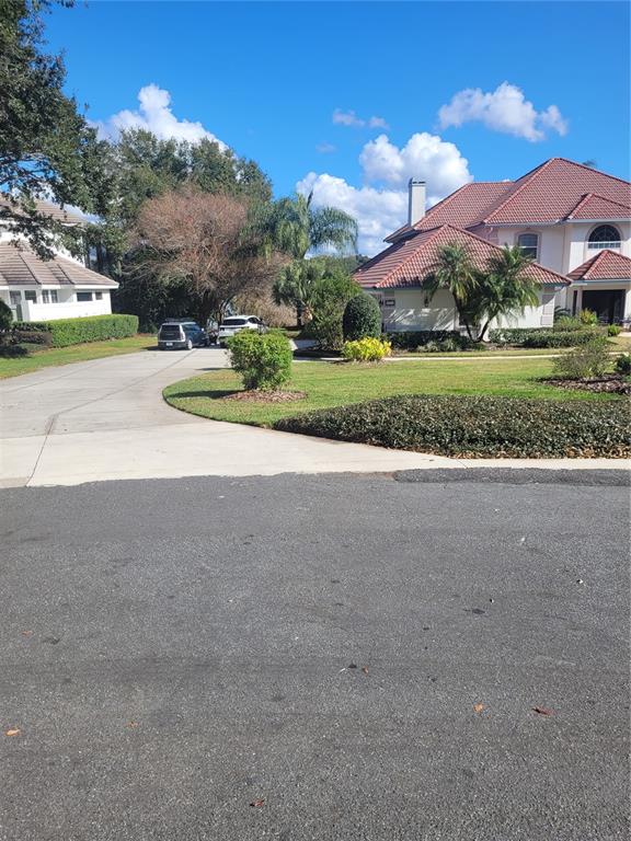 2701 Regal Point Place Eustis, FL 32726 - Photo 5 of 53 a view of a house with a yard and a street
