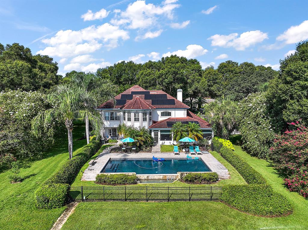 2701 Regal Point Place Eustis, FL 32726 - Photo 6 of 53 a front view of a house with garden