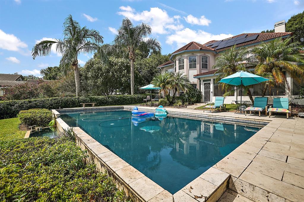 2701 Regal Point Place Eustis, FL 32726 - Photo 7 of 53 a swimming pool with outdoor seating and yard
