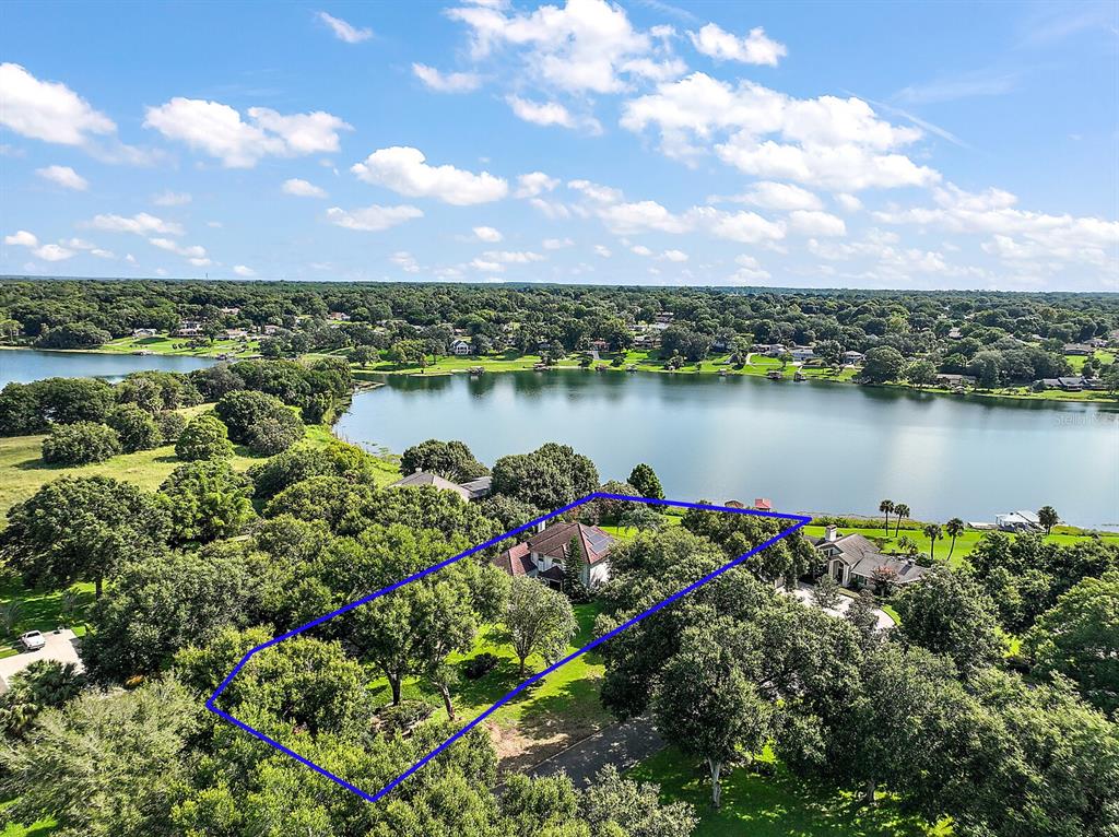 2701 Regal Point Place Eustis, FL 32726 - Photo 10 of 53 a view of a lake with a city
