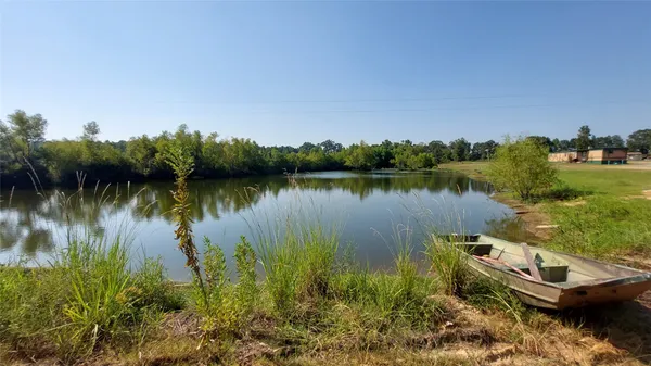 a view of a lake with houses in the back
