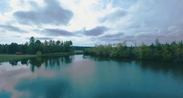 a view of a lake with green space