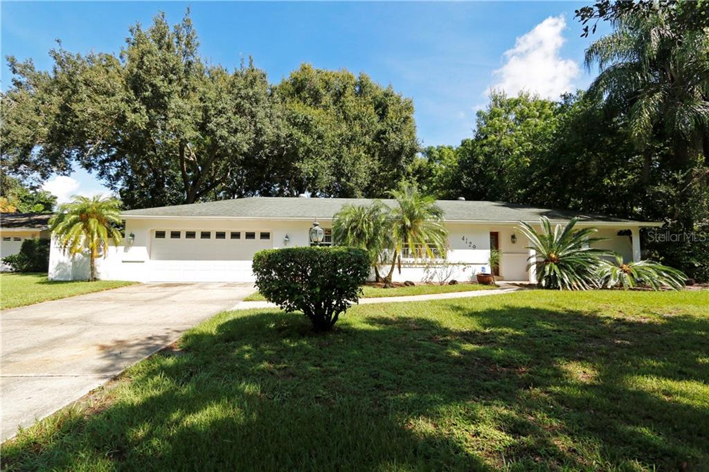 4129 Old Dominion Road Orlando, FL 32812 - Photo 1 of 1 a view of a house with backyard and sitting area