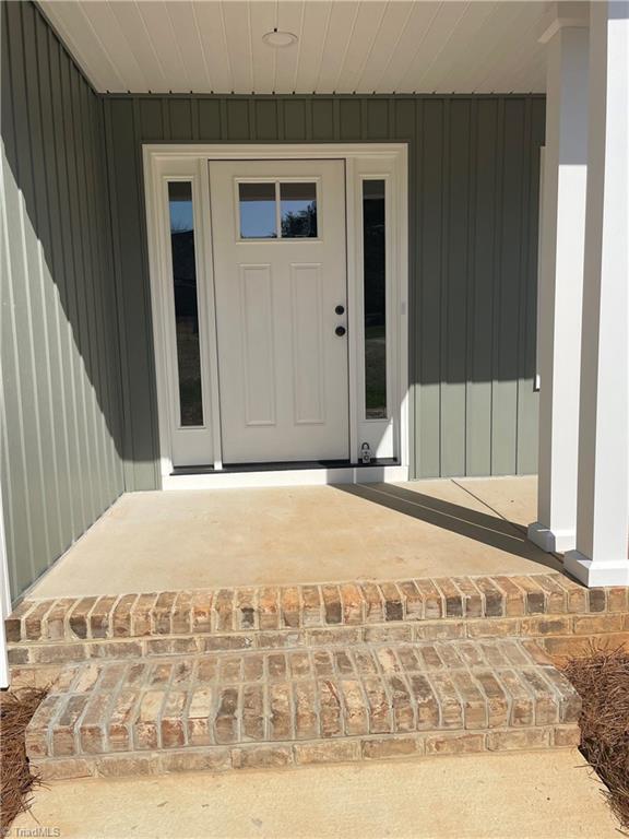 2123 Waterford Pointe Road Lexington, NC 27292 - Photo 2 of 24 Close up front door enhanced by full view sidelights.