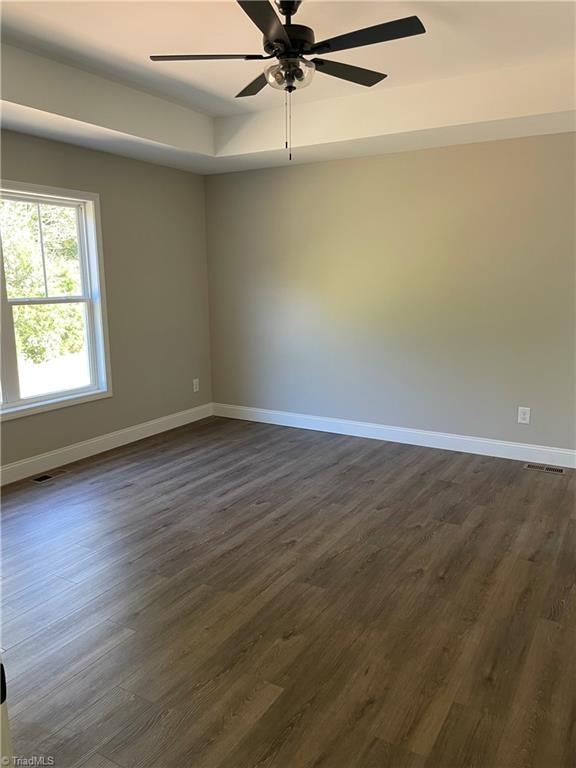 2123 Waterford Pointe Road Lexington, NC 27292 - Photo 7 of 24 Private Primary Bedroom with Tray Ceiling and Fan.