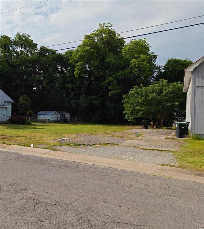 106 East 14th Street Rome, GA 30161 - Photo 2 of 3 a view of a house with a yard and a large tree