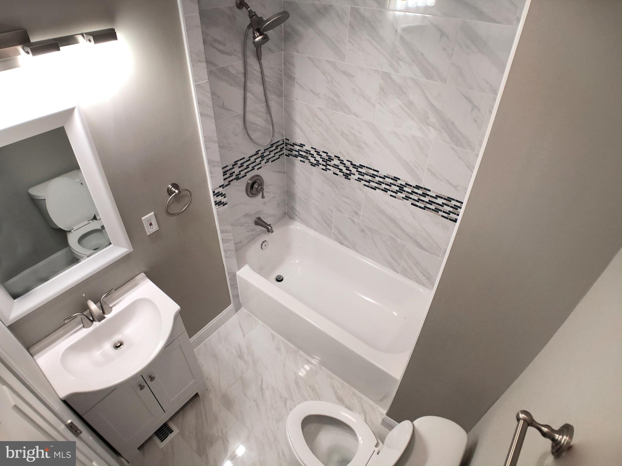 1111 Bayard Street Baltimore, MD 21223 - Photo 19 of 41 a bathroom with a bathtub and shower