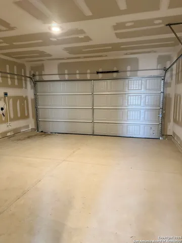 a view of a house with a yard and fence