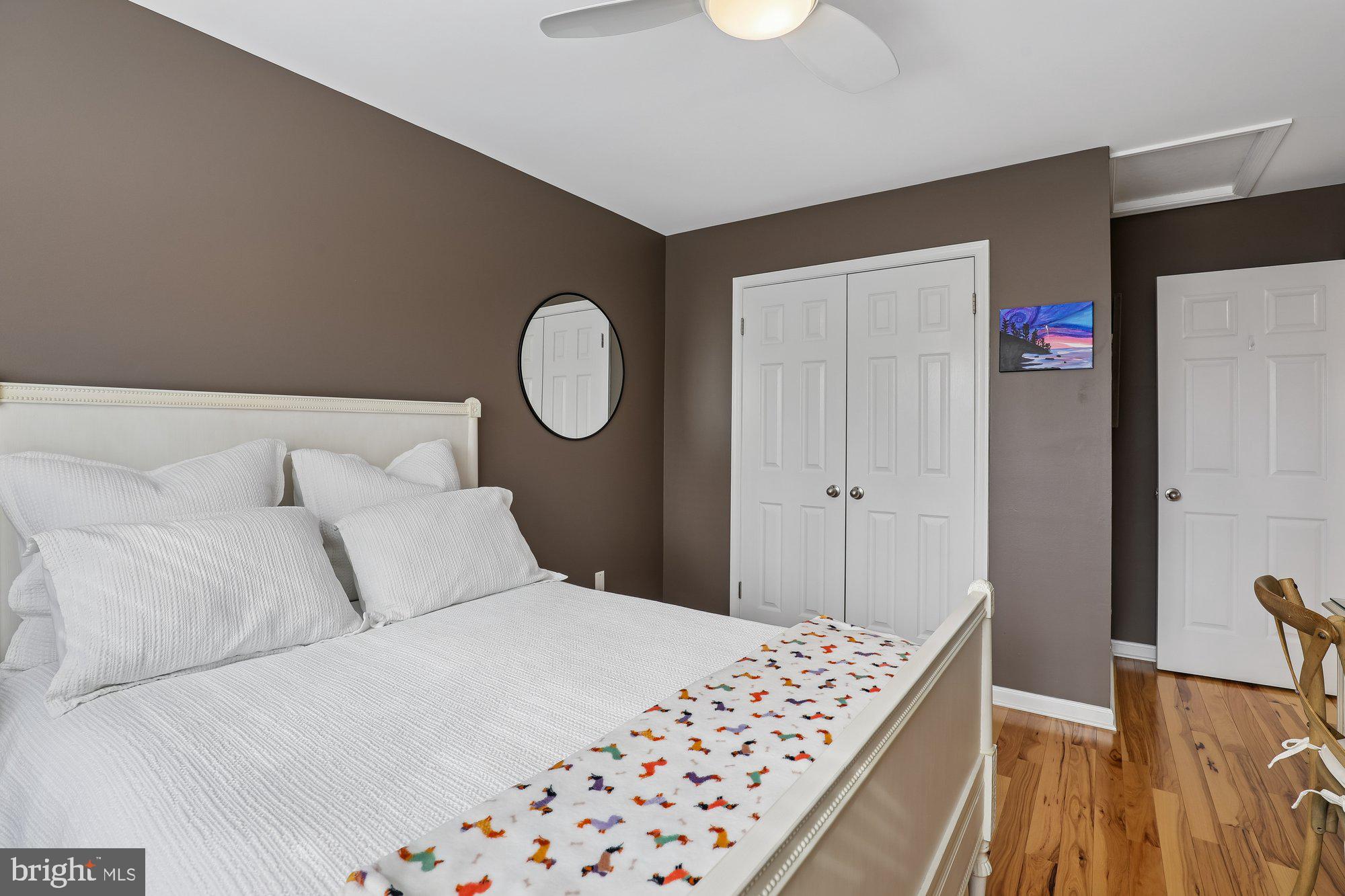 8019 Galla Knoll Circle Springfield, VA 22153 - Photo 32 of 57 a bedroom with a large bed and a dresser
