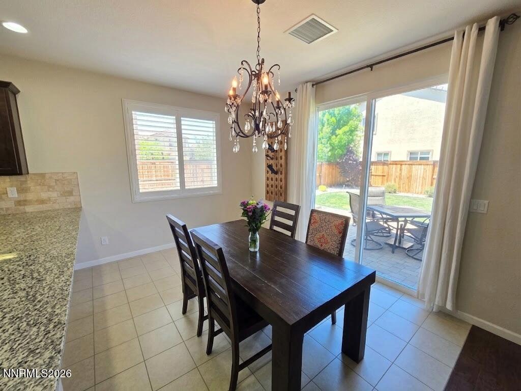 2775 Bonfire Lane Reno, NV 89521 - Photo 16 of 41 a view of a dining room with furniture and wooden floor