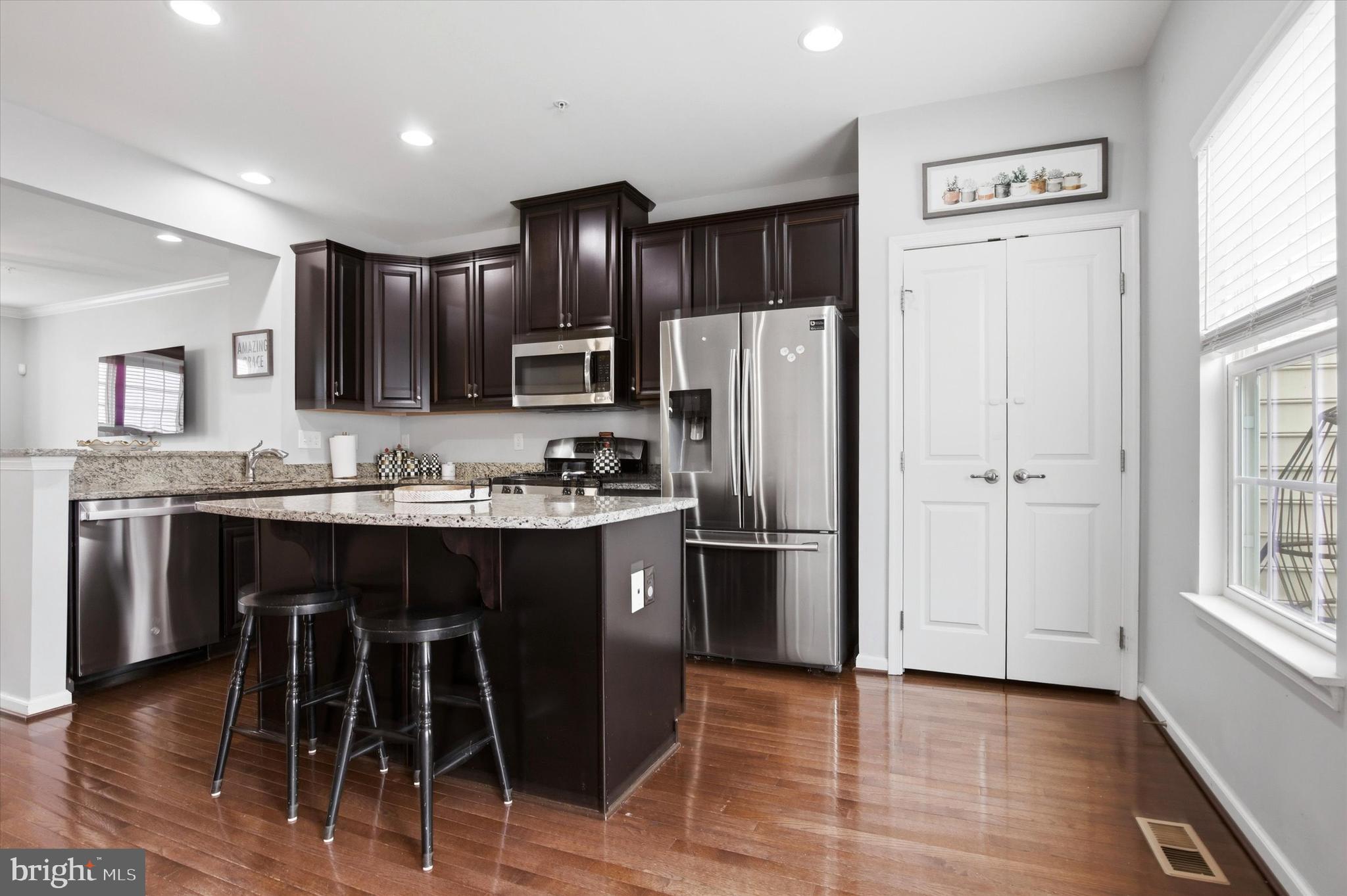 422 Lopata Road Phoenixville, PA 19460 - Photo 16 of 35 a kitchen with stainless steel appliances granite countertop a refrigerator and a stove top oven