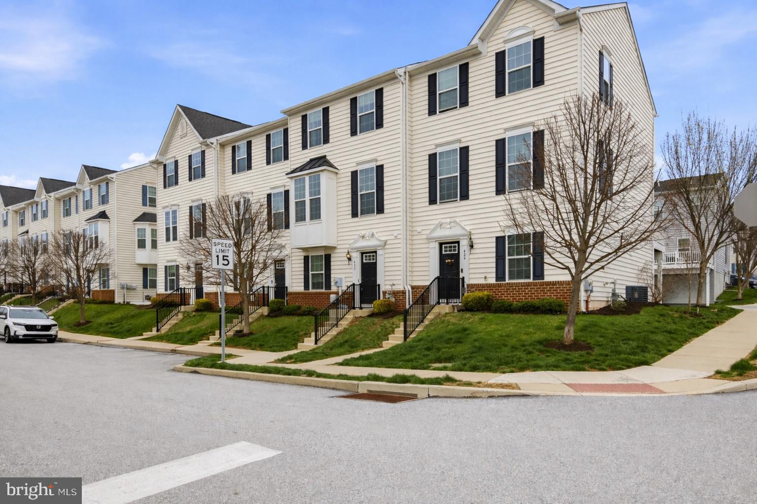 422 Lopata Road Phoenixville, PA 19460 - Photo 2 of 35 a view of a white house with a yard and plants next to a road