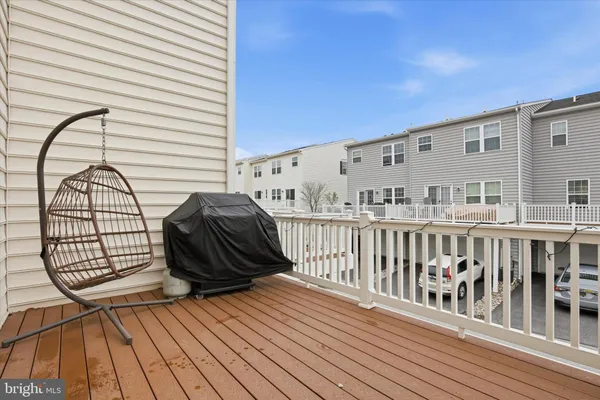 a view of a balcony with wooden floor