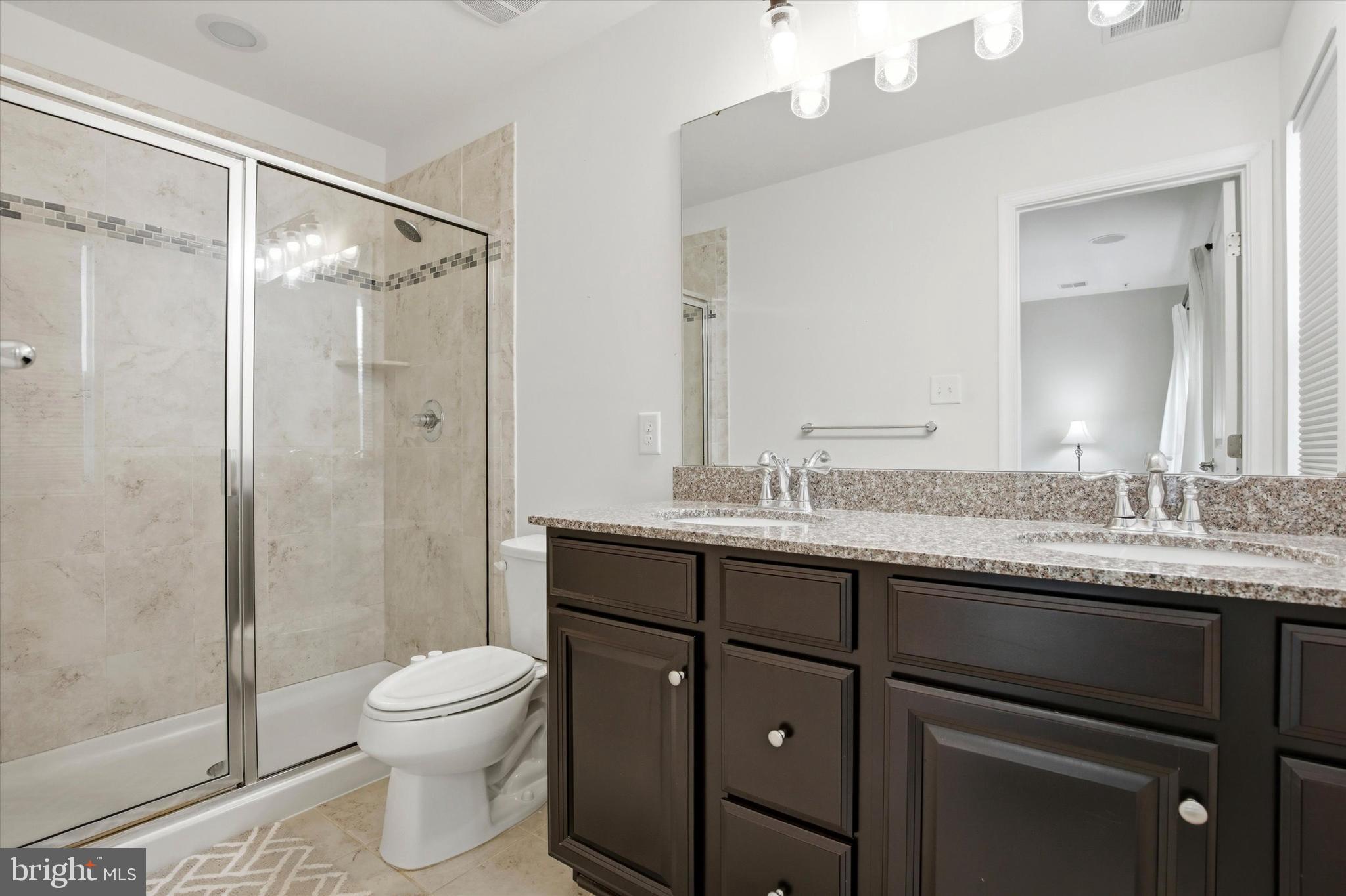 422 Lopata Road Phoenixville, PA 19460 - Photo 26 of 35 a bathroom with a granite countertop sink toilet and shower