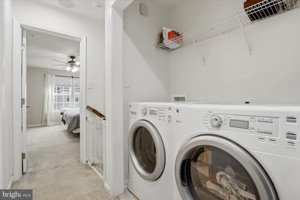 a view of livingroom with washer and dryer