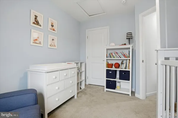 a view of bedroom with cabinet and wall painting