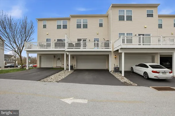 a view of a car park in front of house