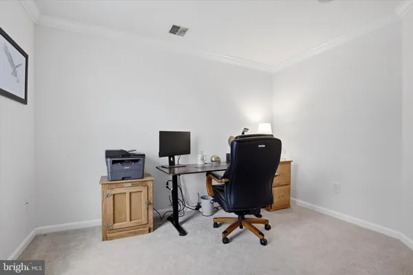 a view of a workspace with furniture