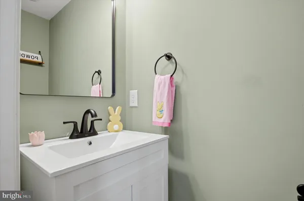 a bathroom with a sink and mirror