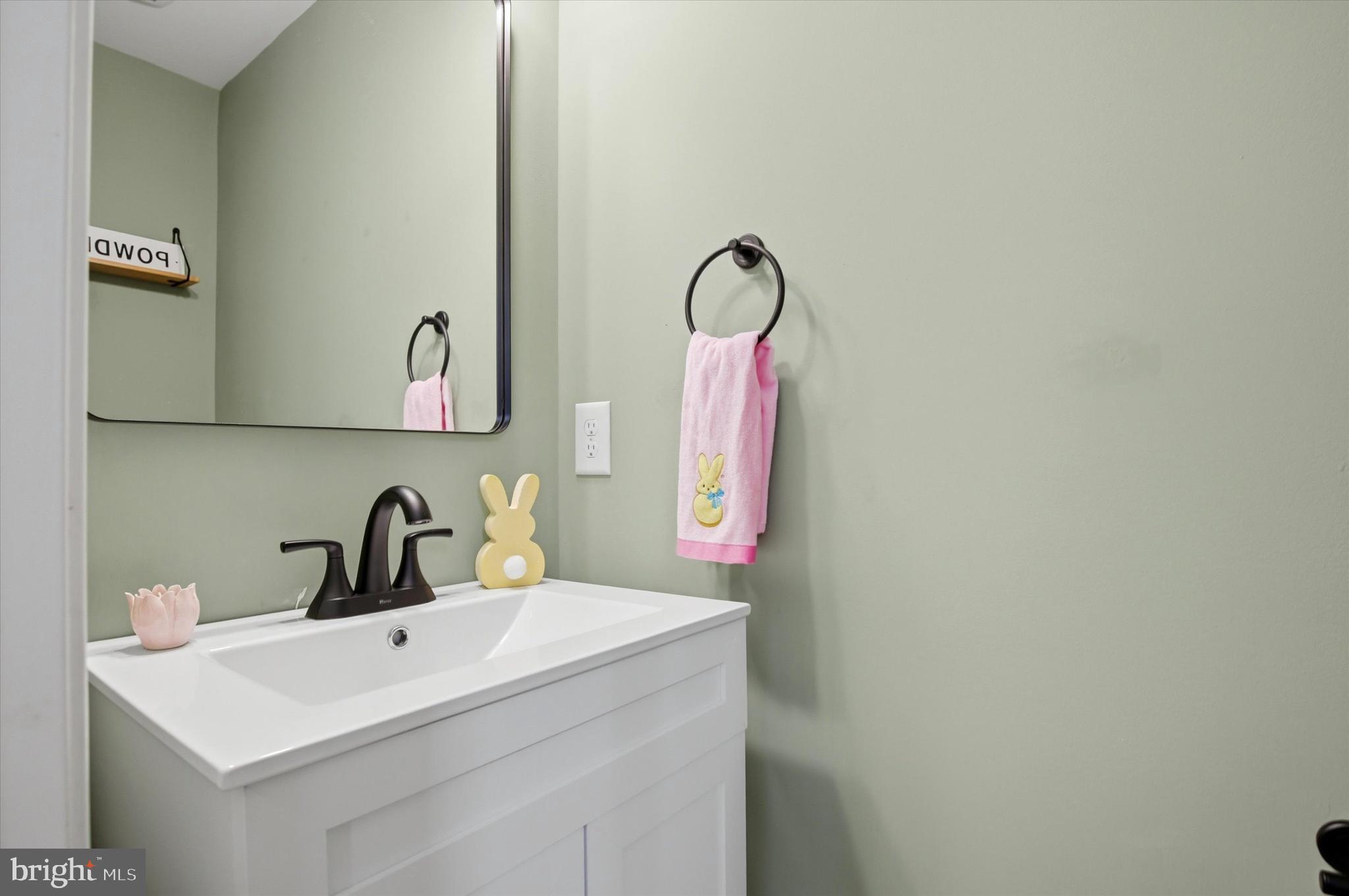 422 Lopata Road Phoenixville, PA 19460 - Photo 9 of 35 a bathroom with a sink and mirror