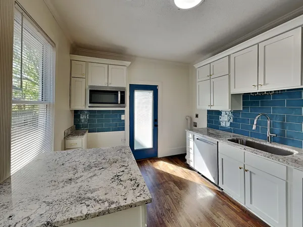 a large kitchen with cabinets