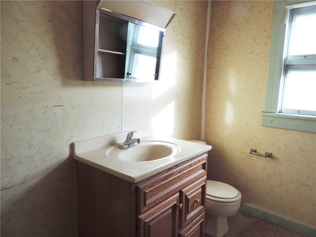 1660 North College Street Decatur, IL 62526 - Photo 8 of 11 a bathroom with a sink and a toilet