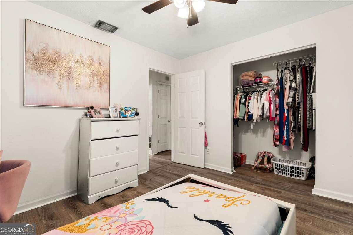 1362 Tara Road Jonesboro, GA 30238 - Photo 15 of 30 a bed room with a bed and a television