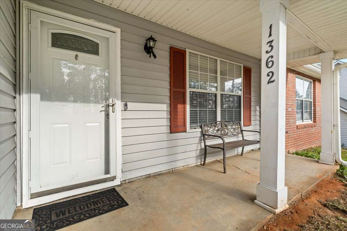 1362 Tara Road Jonesboro, GA 30238 - Photo 3 of 30 a view of a porch with a bench