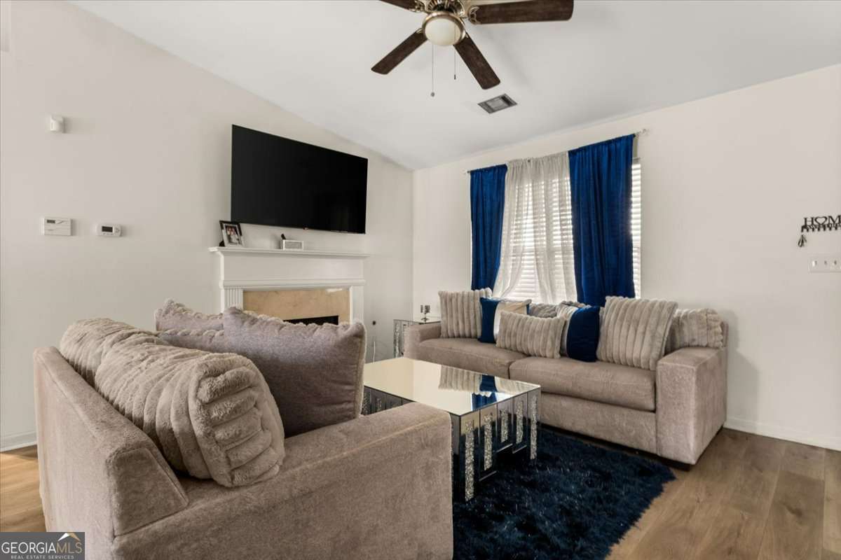 1362 Tara Road Jonesboro, GA 30238 - Photo 5 of 30 a living room with furniture and a flat screen tv