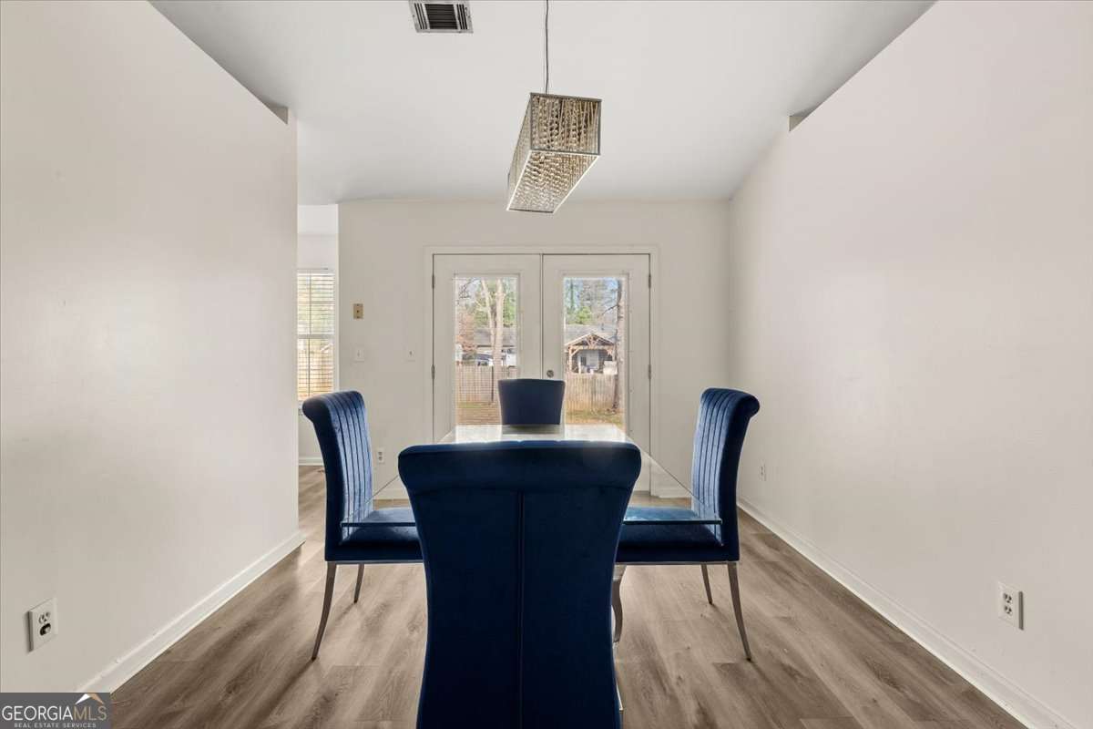 1362 Tara Road Jonesboro, GA 30238 - Photo 10 of 30 a dining room with furniture and window