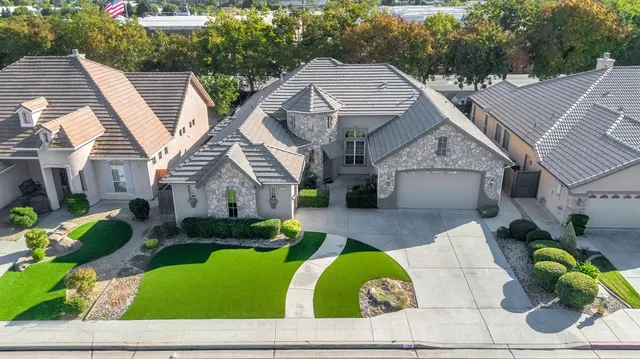 a view of house with outdoor space and sitting area