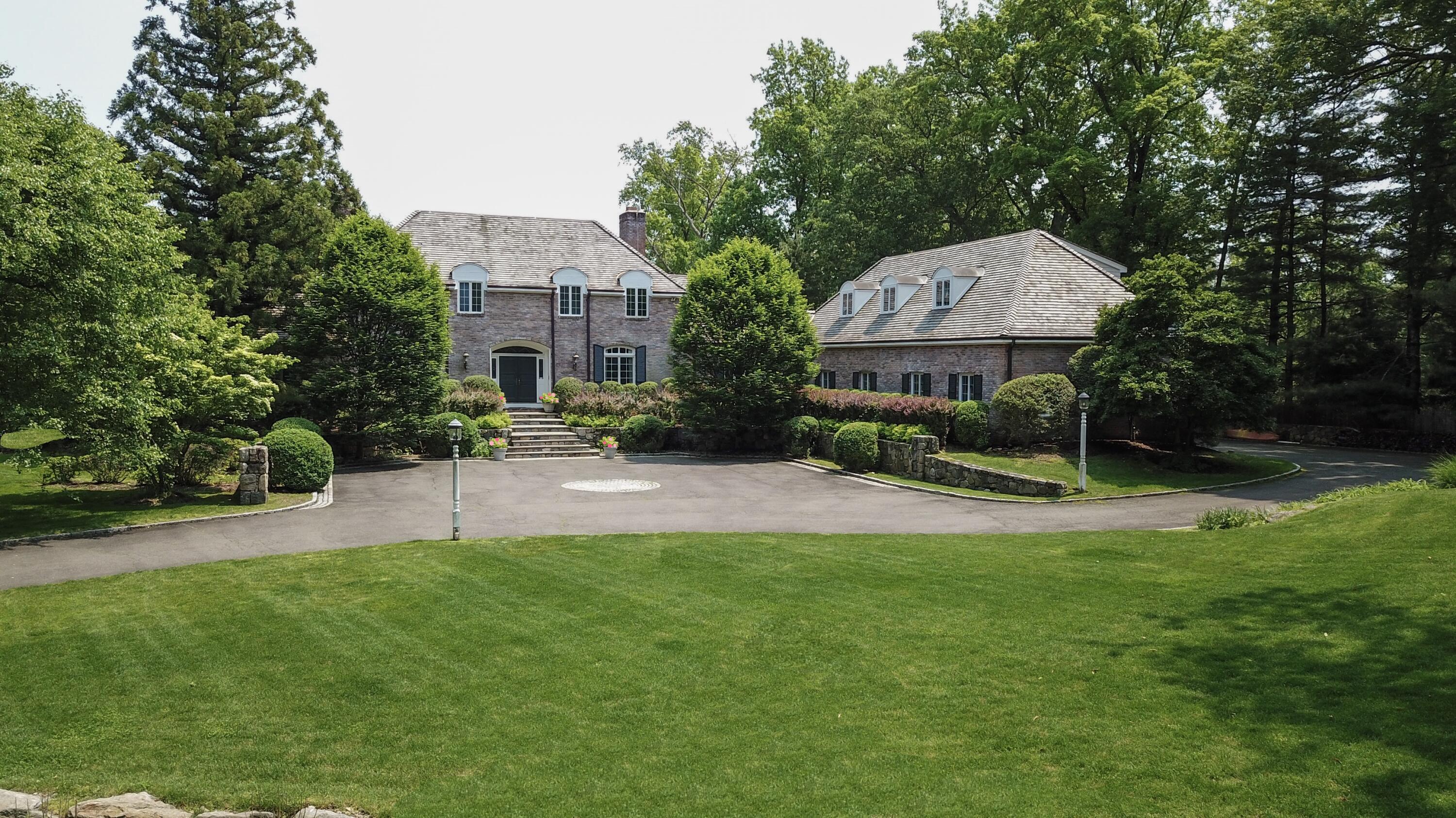 a view of a patio with a table and chairs under an umbrella