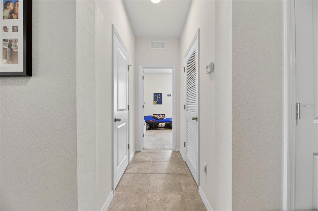 6309 Shadowlake Drive Apollo Beach, FL 33572 - Photo 40 of 64 a view of a hallway with wooden floor and windows