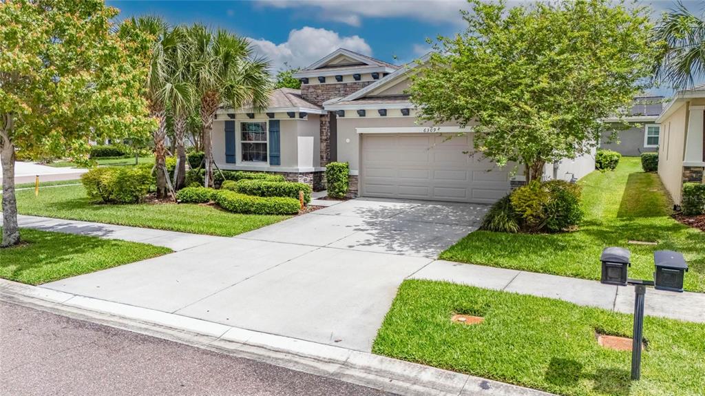 6309 Shadowlake Drive Apollo Beach, FL 33572 - Photo 53 of 64 front view of a house with a yard