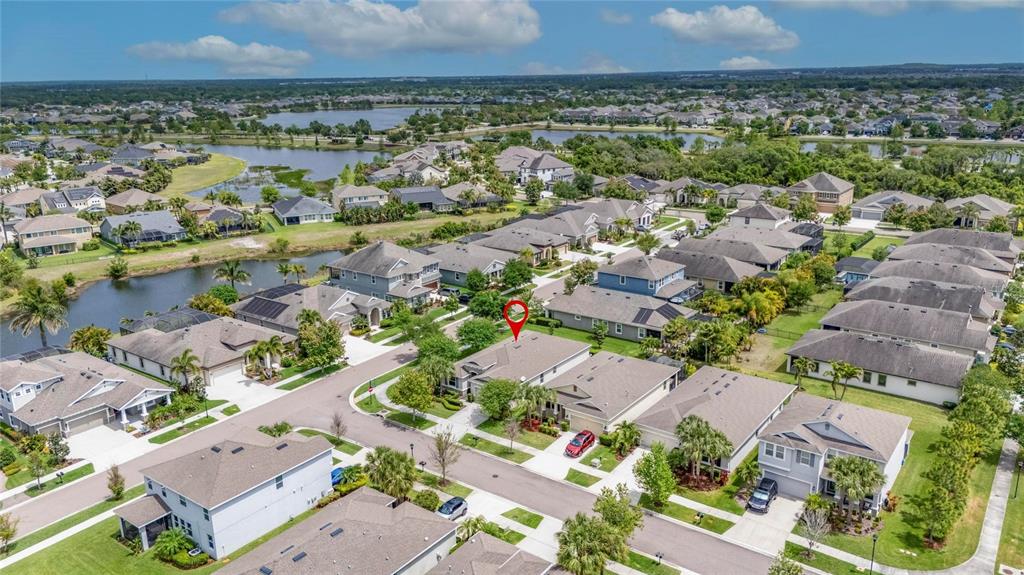 6309 Shadowlake Drive Apollo Beach, FL 33572 - Photo 61 of 64 an aerial view of a city and lake view