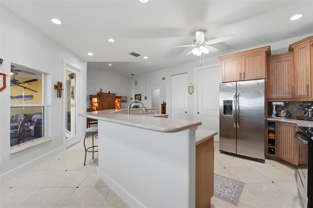 3260 Peace River Drive Punta Gorda, FL 33983 - Photo 12 of 59 a kitchen with stainless steel appliances a refrigerator sink and cabinets