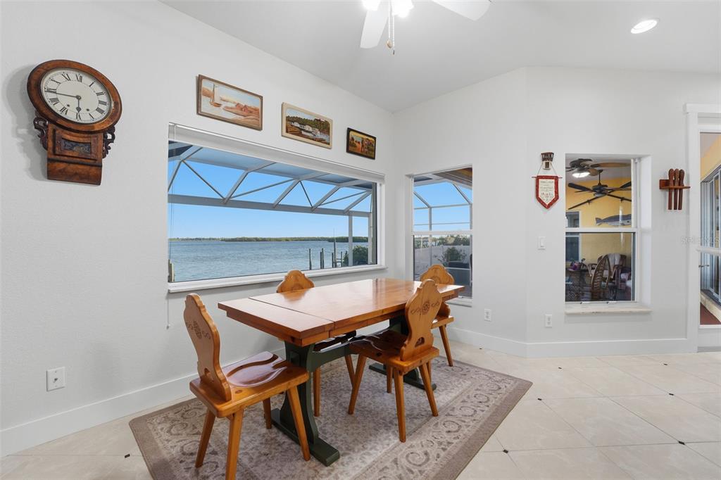 3260 Peace River Drive Punta Gorda, FL 33983 - Photo 13 of 59 a dining room with a table and a clock