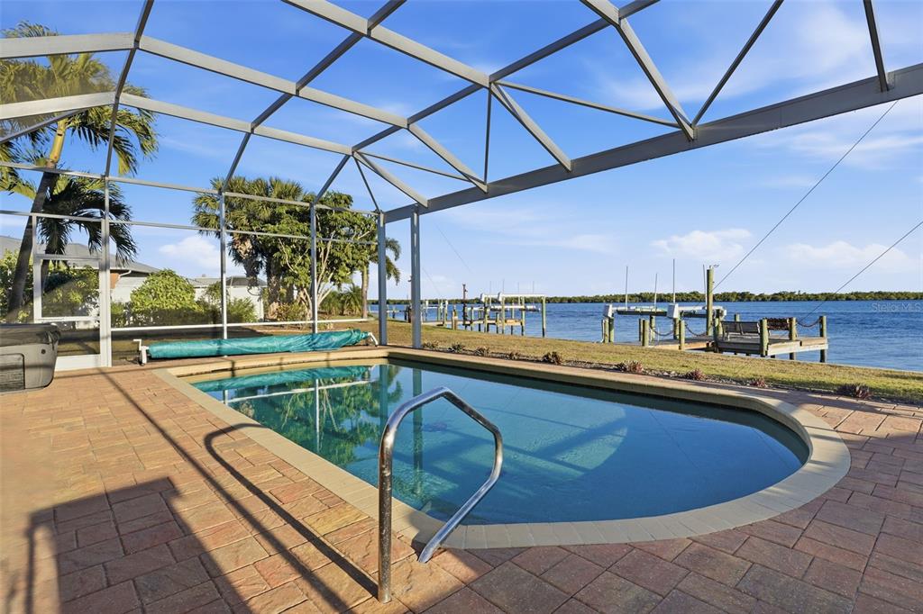 3260 Peace River Drive Punta Gorda, FL 33983 - Photo 3 of 59 a view of a swimming pool with a roof deck