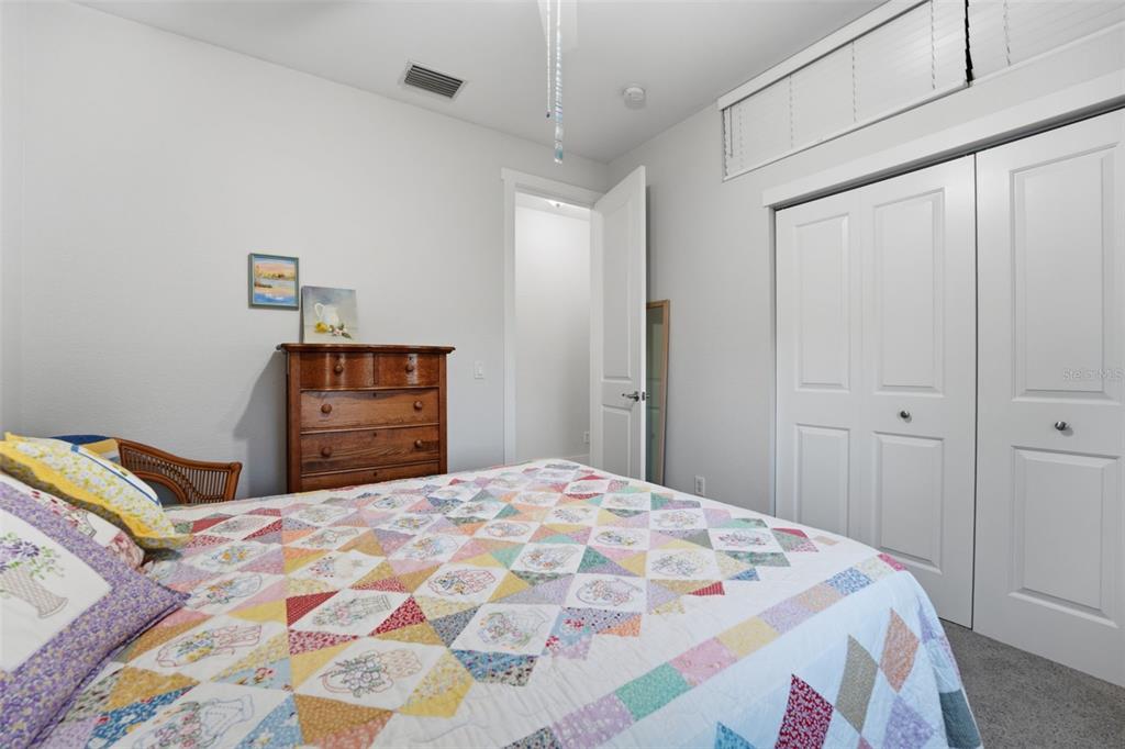 3260 Peace River Drive Punta Gorda, FL 33983 - Photo 33 of 59 a bedroom with a bed and a dresser