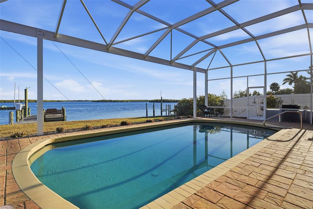 3260 Peace River Drive Punta Gorda, FL 33983 - Photo 41 of 59 a kitchen with stainless steel appliances kitchen island granite countertop a sink a counter space and cabinets