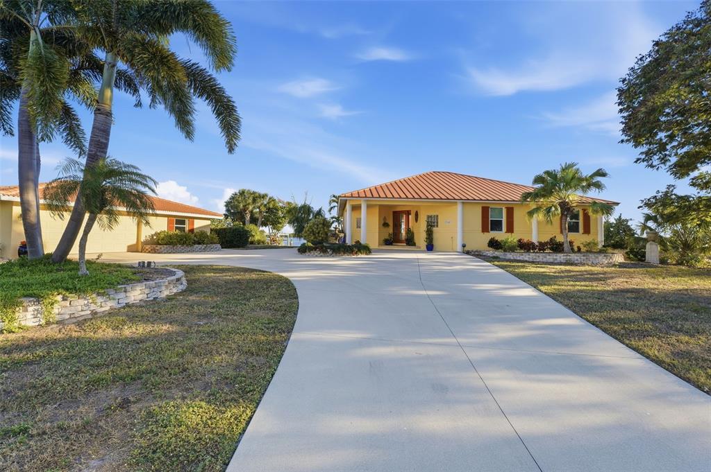 3260 Peace River Drive Punta Gorda, FL 33983 - Photo 56 of 59 a front view of a house with a yard