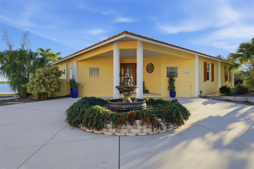 3260 Peace River Drive Punta Gorda, FL 33983 - Photo 59 of 59 a front view of a house with garden