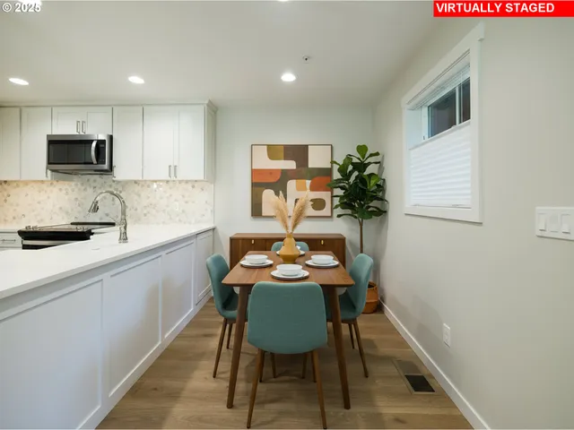 a view of a dining room with furniture and wooden floor