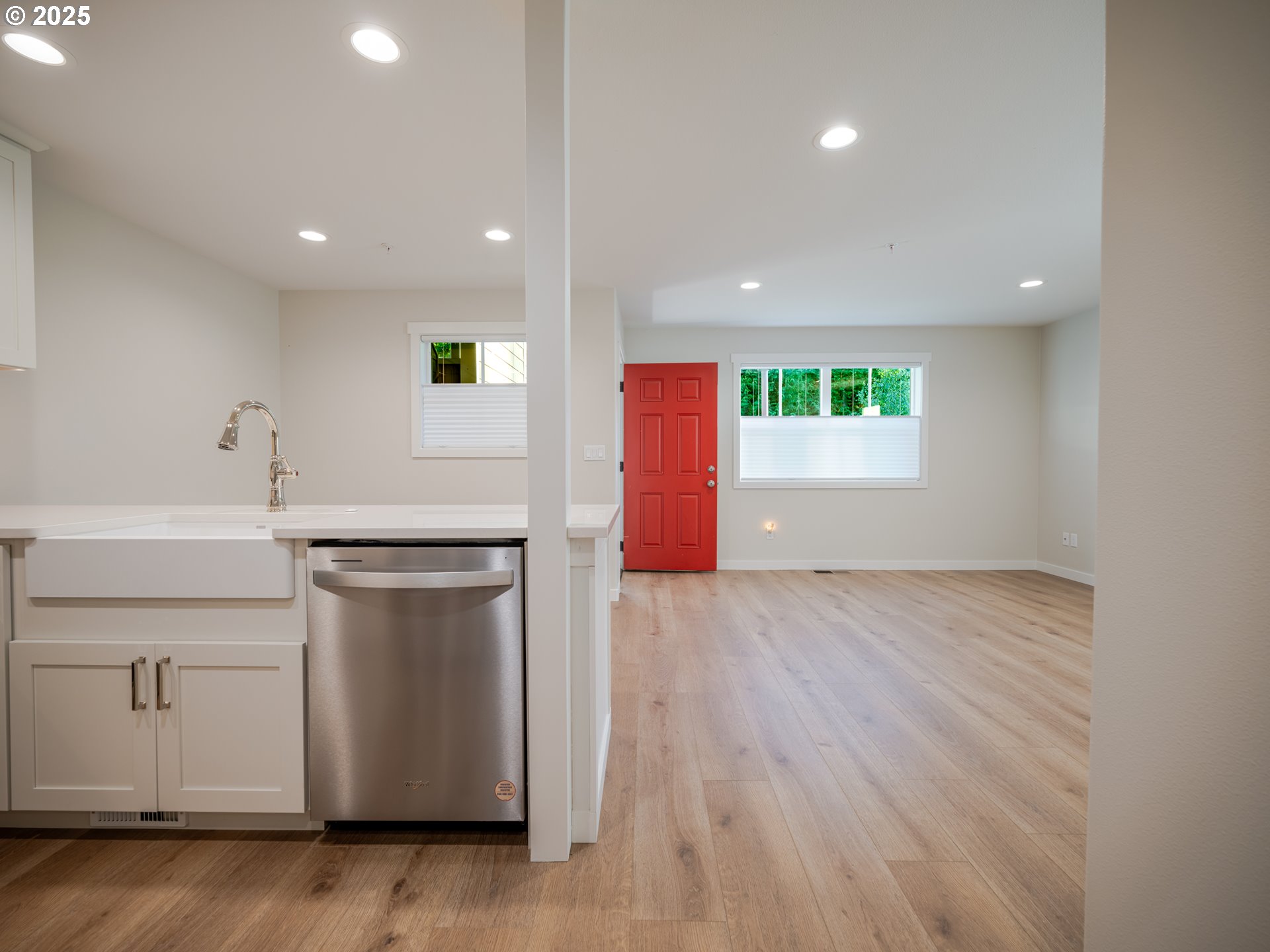 420 Elk Creek Road, Unit 401 Cannon Beach, OR 97110 - Photo 21 of 31 a kitchen with a sink cabinets and wooden floor