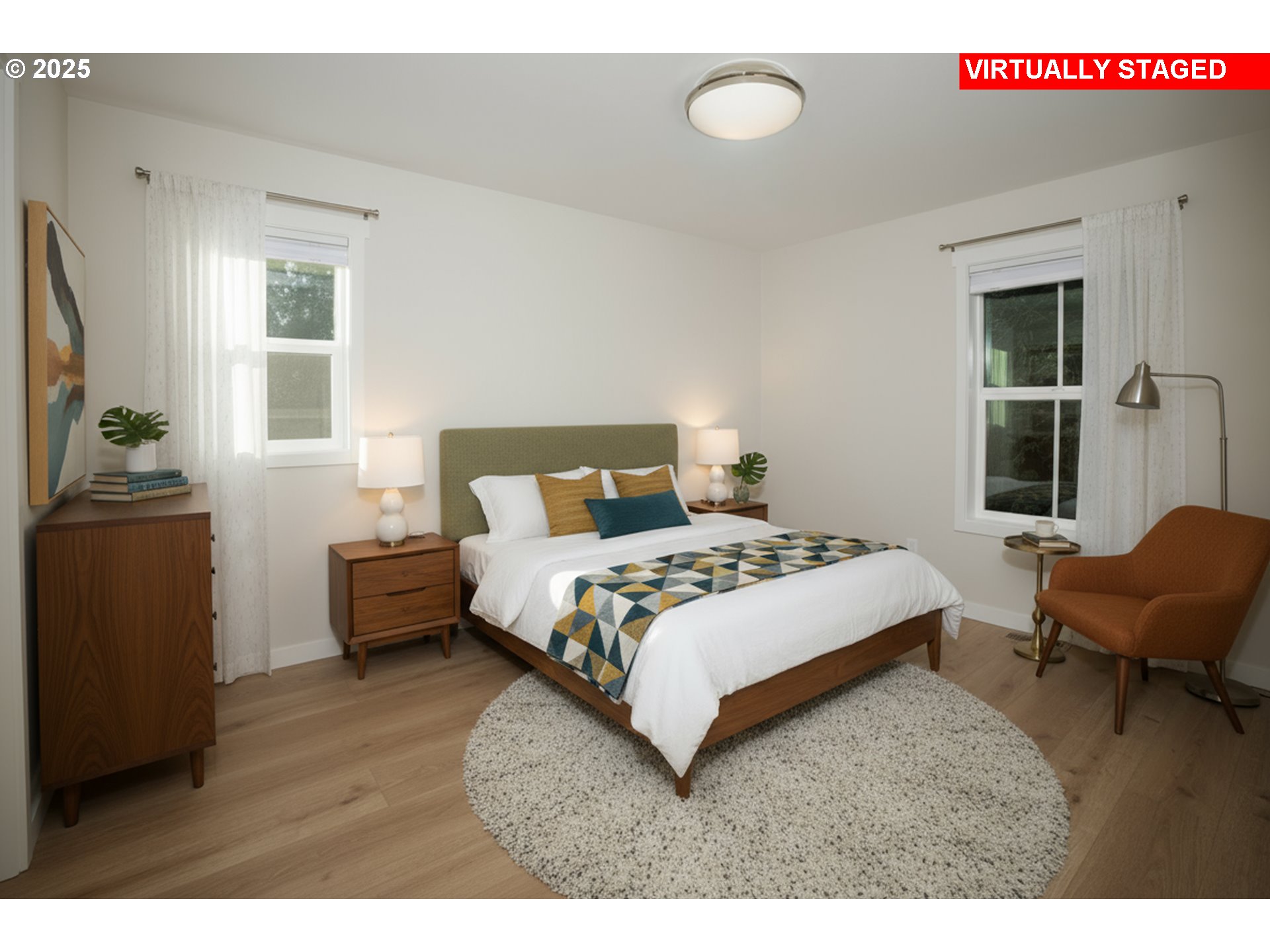 420 Elk Creek Road, Unit 401 Cannon Beach, OR 97110 - Photo 25 of 31 a bedroom with a bed and wooden floor