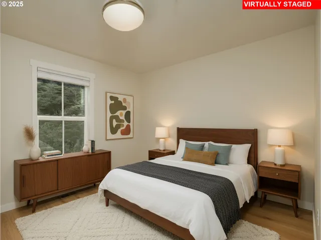 a bedroom with a large bed and a window