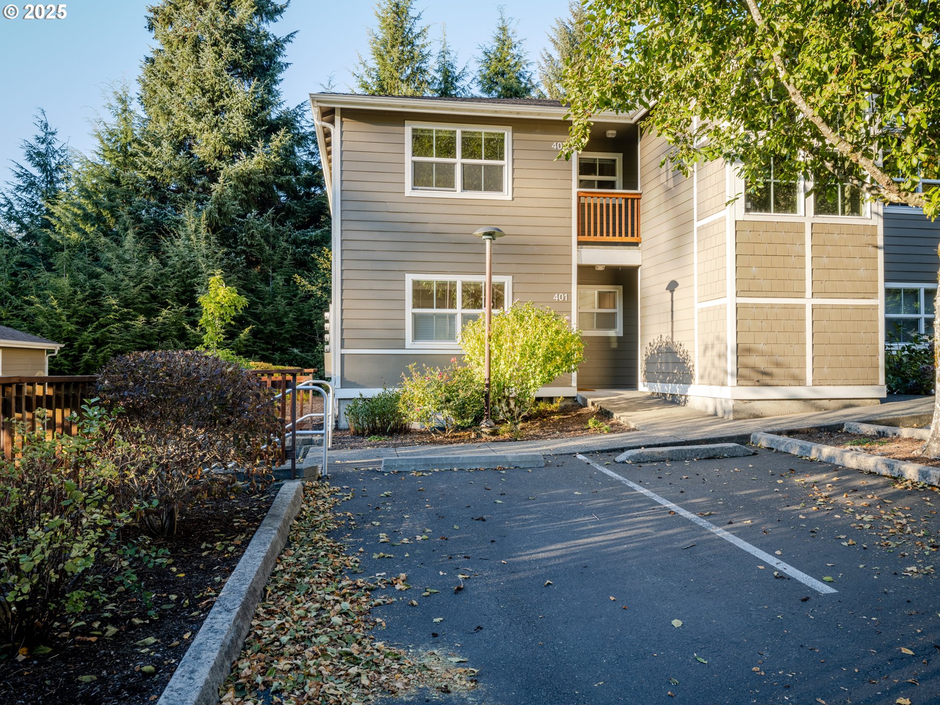 420 Elk Creek Road, Unit 401 Cannon Beach, OR 97110 - Photo 4 of 31 a view of a house with backyard and garden