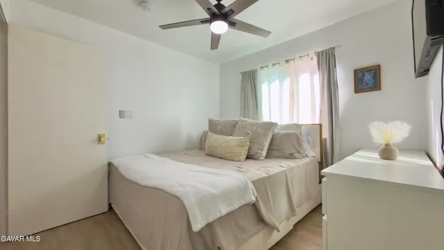 a bedroom with a bed and window